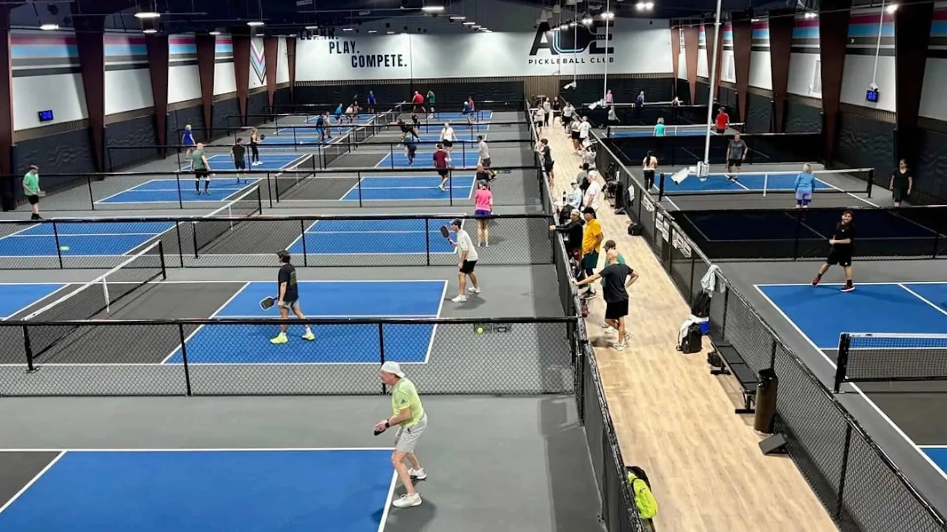 Players on more than a dozen indoor courts at ACE Pickleball Club